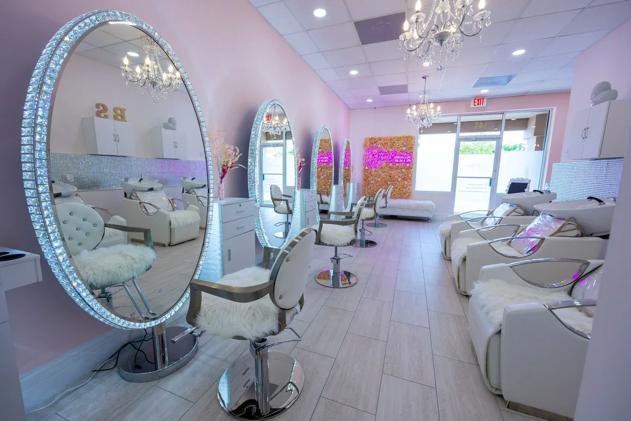 Hollywood vanity mirror and glam stations ready for guests at The Beauties Salon in Naples